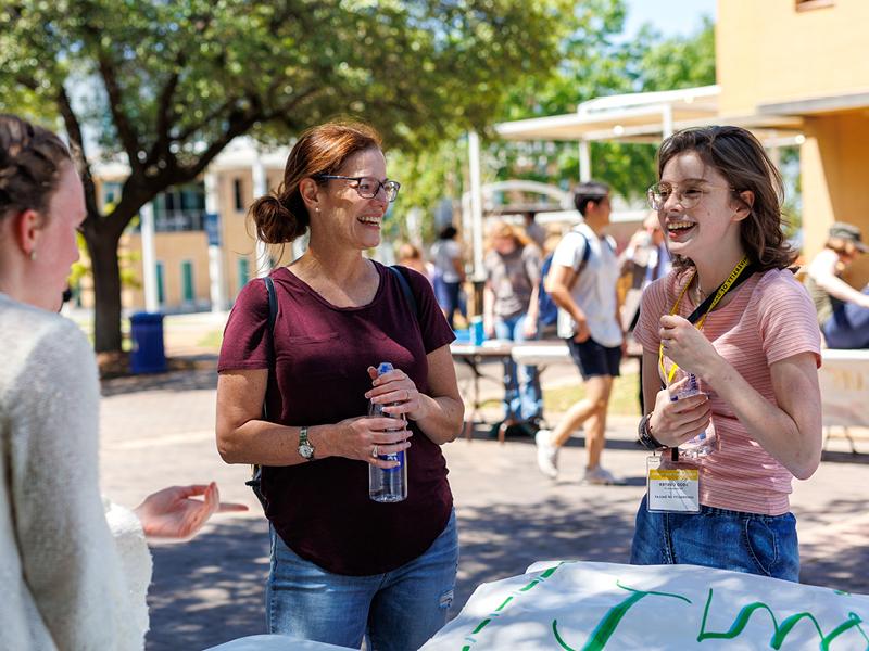 Happy students talking on the mall